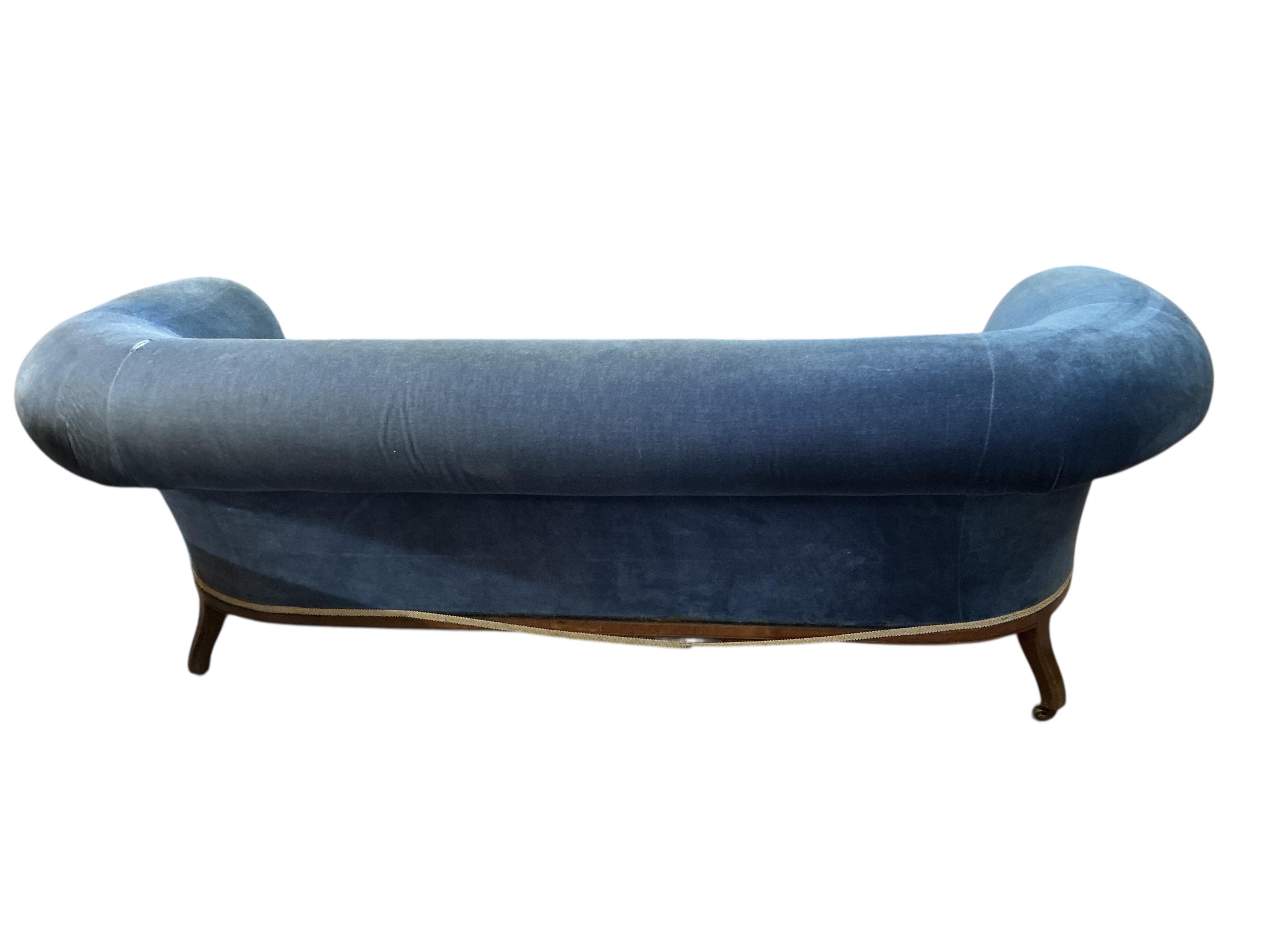 A late Victorian upholstered mahogany settee, width 200cm, depth 86cm, height 76cm.